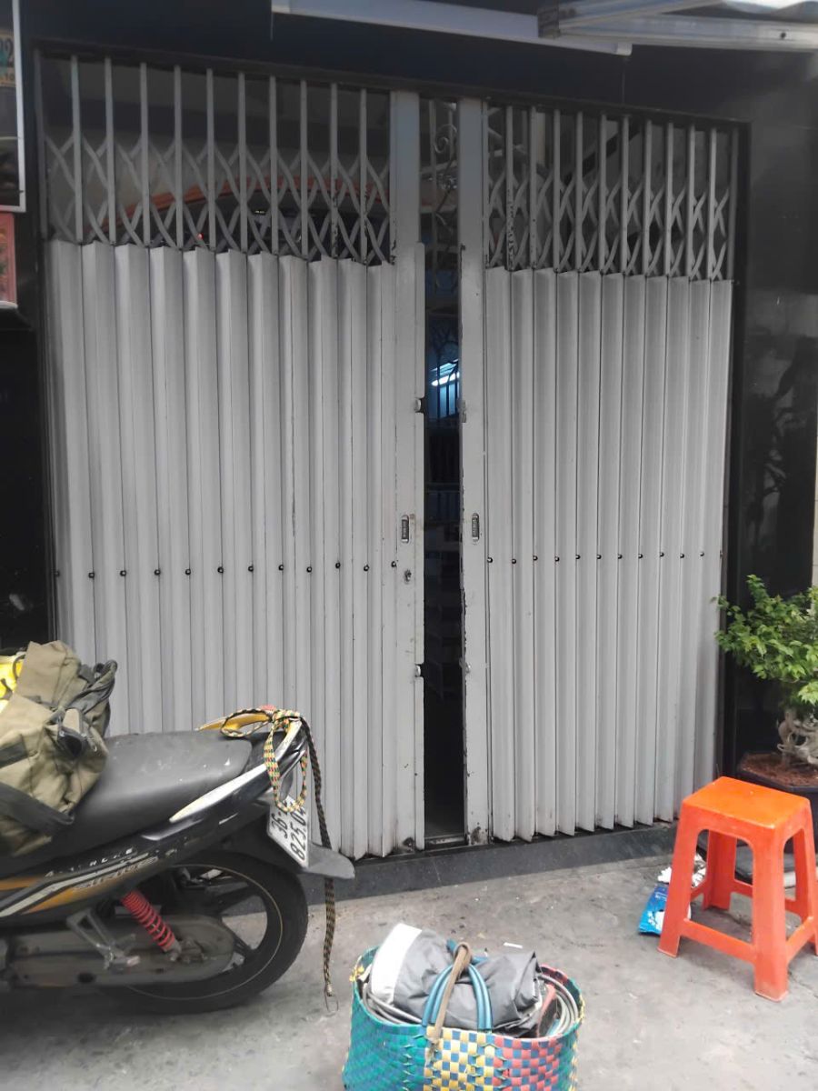 sửa cửa sắt kéo quận 1